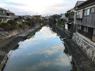 Reflection of Sky and Cloud on Canal in the City