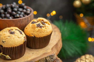 front view delicious fruity cakes around holiday tree toys on a dark background dessert cake sweet photo cream
