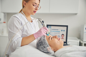 Woman being treated by a professional dermatologist