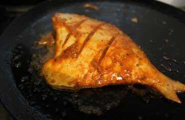 Pomfret fish in a pan