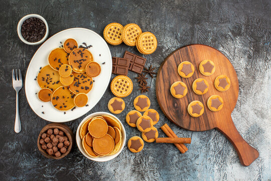 Overhead View Of Different Sorts Of Desserts On Grey Background