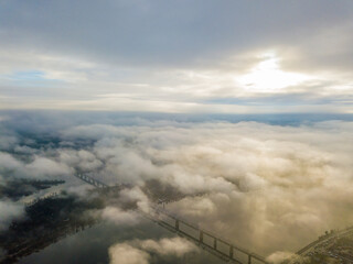 Fototapeta na wymiar Aerial drone view. Railway bridge in Kiev, shrouded in morning fog.