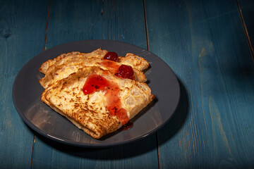 Russian pancakes with strawberry jam. Russian cuisine.