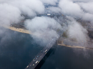 Aerial drone view. North bridge in Kiev, shrouded in morning fog.