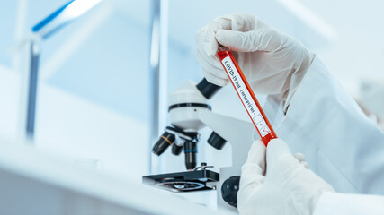 close up. laboratory employee sitting at the laboratory table