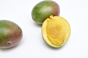ripe mango sliced on white background
