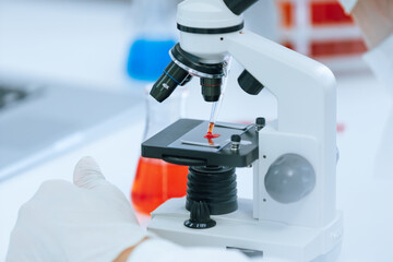close up. microscope is on the table in the lab.