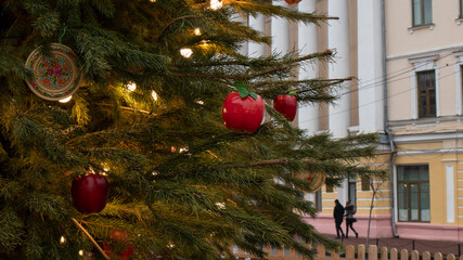  Fragment of a Christmas tree with decorations outside. 