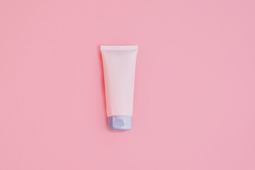 Flat lay with night or day cream, white clay facel mask in jar on pinkbackground. Beauty background with facial cosmetic products. Spa concept. Beauty blogger, salon treatments concept. Minimalism.