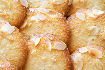 close up of a cookies wits almond flakes.