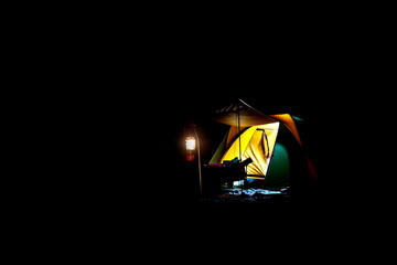 Tourist tents and lights in Dark  night background