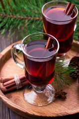 Mulled wine, cinnamon sticks, anise stars, fir cones and branches