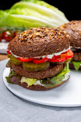 Grilled plant based, meat free vega burgers close up