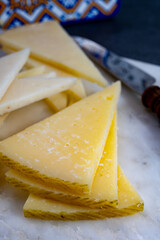 Spanish snacks tapas, variety of sliced goat, sheep, manchego cheeses