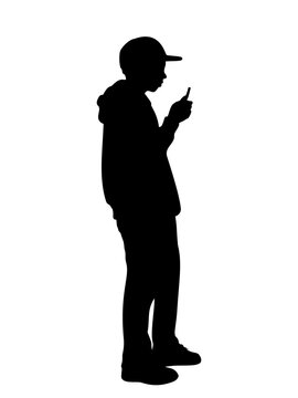 Silhouette boy looking at the phone