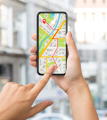 Navigation App With Street Map Opened On Smartphone In Female Hands