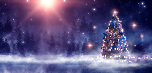 Night winter forest fantasy landscape with a Christmas decorated tree. Festive bokeh lights, dark forest, neon lights. Decorated Christmas tree in the night forest. Background for postcards. 