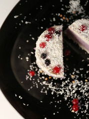 healthy cake with berry on the black plate