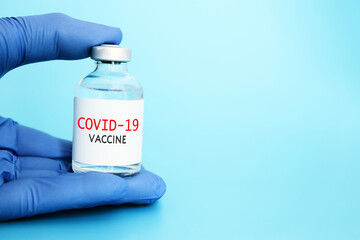 Doctor or nurse holding covid 19 vaccine. Healthcare and Medical concept