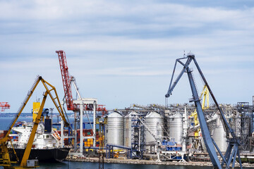 Fototapeta na wymiar Port Cranes, Pier of Seaport. Container terminal. Sea trade port