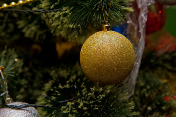 Fototapeta na wymiar Christmas tree with decorations. Close up. Selective focus.