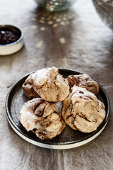Homemade sweet chocolate meringue cookies on plate over greige linen tablecloth. Delicious and light holiday dessert