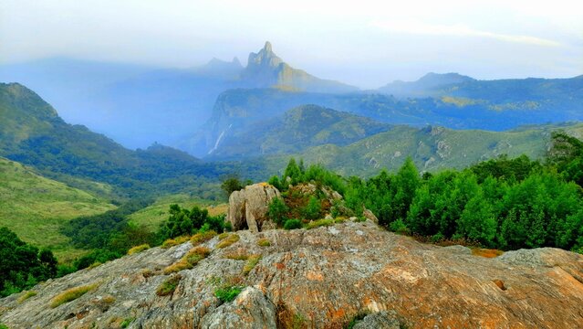 beautiful scenic view from Kodanad View Point of misty rain cloud hill mountain green forest
