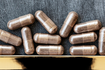 close-up of licorice (DGL) capsules. dietary concept. dietary supplement topview.