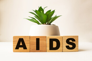 wooden cubes with text AIDS . the medicine. medical concept