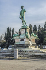 Fototapeta premium Bronze replica of statue David in the center of Michelangelo Square (Piazzale Michelangelo, 1869) in Florence (Firenze). Italy.