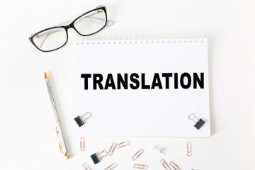 Notepad with inscriptions TRANSLATION on a white background. business concept.