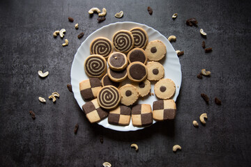 View from top of variety of cookies in a plate on a background with use of selective focus.