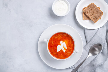 Traditional ukrainian russian soup (borscht) with bread and sour cream