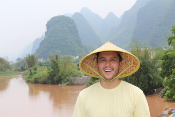 Man with Asian river background