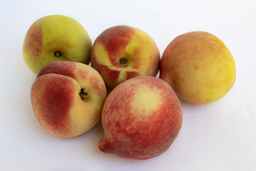 Delicious ripe peaches on white background