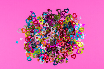 Pink background with colorful hearts. Love concept, Valentine's Day greeting card. View from above....