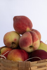 Peaches stacked in fruit basket