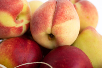 Fototapeta na wymiar Close up of peaches and nectarines in basket