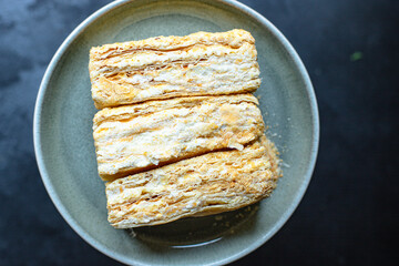 cake napoleon puff pastry millefeuille and butter cream dessert sweet piece portion ready to cook and eat on the table for healthy meal snack top view copy space for text food background rustic image