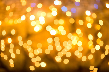 Festival Christmas background of Golden glowing bokeh