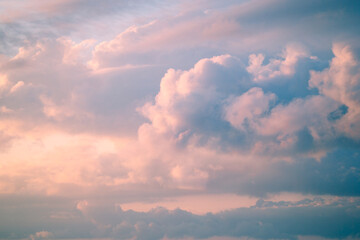 Naklejka na ściany i meble Beautiful pink sunset in the sky with clouds