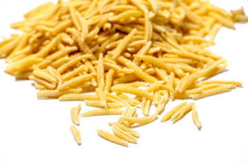 Raw Malloreddus, typical Sardinian pasta  isolated in white background