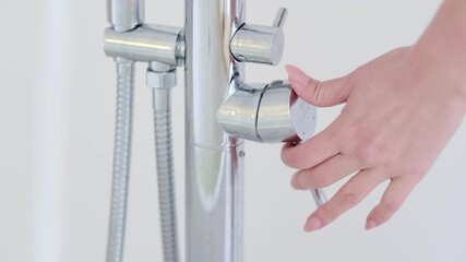 Water dripping to stop running as hand turn off the faucet. Save the water concept. Detect a Leak week. hand close water tap. Selective focus. Slow motion video. stock footage