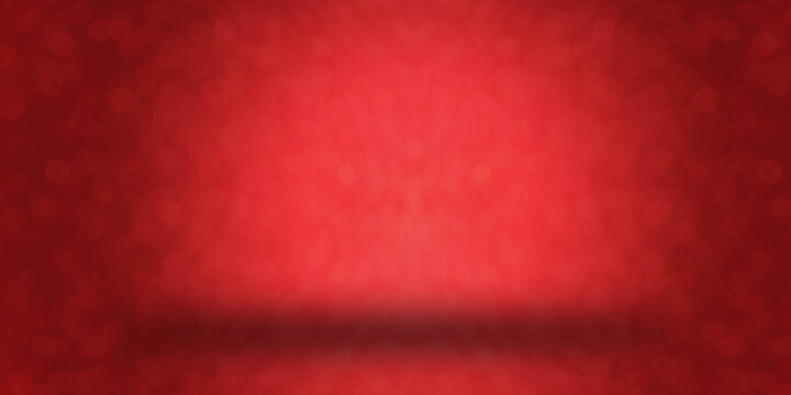 Abstract red sparkling blurry background for Christmas or Valentine's day. Place to insert objects in the center.