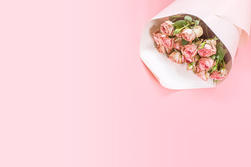 Pink roses bouquet on pink background, Valentine's day background