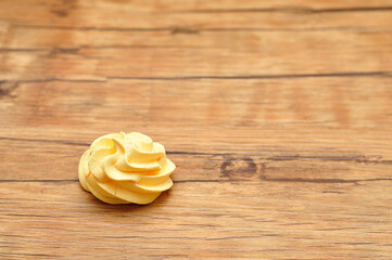 A yellow meringue on a table