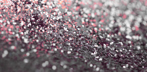 Soft focus pink and silver glitter shine dots confetti. Abstract light blur blink sparkle backgound.