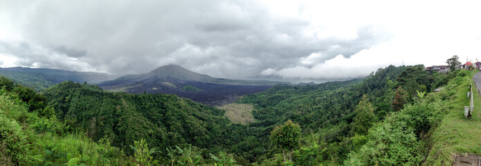 Gunung Batur is active volcano in the tropical island of Bali. The height of the volcano is 1717 meters
