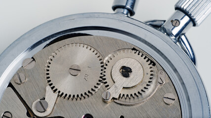 fragment of the winding mechanism from the stopwatch, rear view with the cover removed