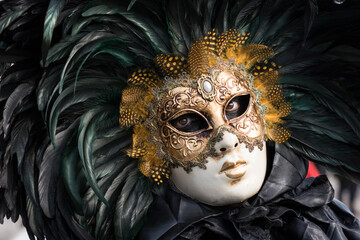 Venice, Italy - February 16, 2020: An unidentified person in a carnival costume in Piazza San Marco attends at the Carnival of Venice.